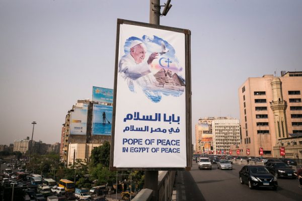 A poster in Cairo. Pope Francis is expected to highlight the plight of Christians while continuing his mission to reach out to Muslims. Credit David Degner for The New York Times 