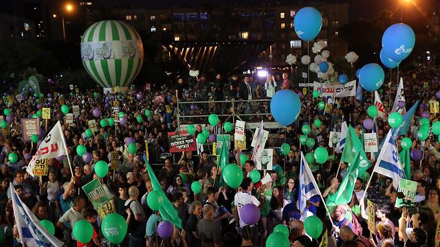 Thousands of Israelis rallied Saturday in Tel Aviv under the heading "Two states, one hope," in support of a Palestinian state ahead of the 50th anniversary of Israel's occupation of Palestinian land.