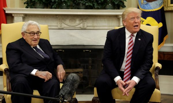 Former secretary of state Henry Kissinger, left, and President Trump speak to reporters in the Oval Office. May 10,2017 (Kevin Lamarque/Reuters) 