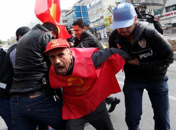 Plainclothes police officers detain a protester as he and others attempted to defy a ban and march on Taksim Square to celebrate May Day, in Istanbul, Turkey, May 1, 2017. REUTERS/Murad Sezer