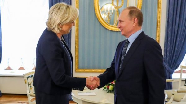 Russian President Vladimir Putin, right, shakes hands with French far-right presidential candidate Marine Le Pen, in the Kremlin in Moscow, Russia, on March 24, 2017. (Mikhail Klimentyev, Sputnik, Kremlin Pool Photo via AP)