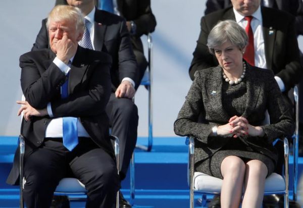 U.S. President Donald Trump (L) and Britain's Prime Minister Theresa May react during a ceremony at the new NATO headquarters before the start of a summit in Brussels, Belgium, May 25, 2017.    REUTERS/Christian Hartmann