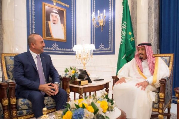 Saudi Arabia's King Salman bin Abdulaziz Al Saud (R) meets with Turkish Foreign Minister Mevlut Cavusoglu in Jeddah, Saudi Arabia, June 16, 2017. Bandar Algaloud/Courtesy of Saudi Royal Court/Handout via REUTERS