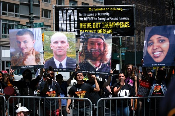 People hold up signs during a rally to support Muslim rights as a counter-protest to an anti-sharia law rally origanized by ACT for America Saturday in New York. (Kena Betancur/AFP/Getty Images) Across the street, separated by police officers and barricades, a few hundred mostly young people — including labor activists, Jewish and Muslim protesters, and left-wing anarchists — blasted air horns and whistles and held banners that read “Fascists out of NYC.” From a stage adorned with an American flag, Pax Hart, who organized ACT’s march, 