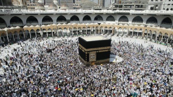 Muslim pilgrims sit around the Kaaba, the cubic building at the Grand Mosque, ahead of the annual Hajj 