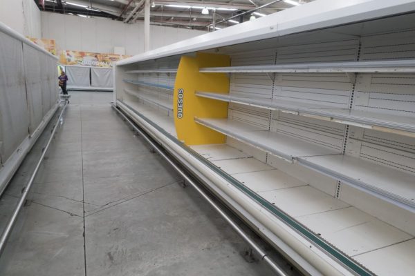 Empty refrigerator shelves are pictured at a Makro supermarket in Caracas, Venezuela, August 4, 2015. Venezuelan supermarkets are increasingly being targeted by looters, as swollen lines and prolonged food shortages spark frustration in the OPEC nation struggling with an economic crisis. Photo by Carlos Garcia Rawlins/Reuters