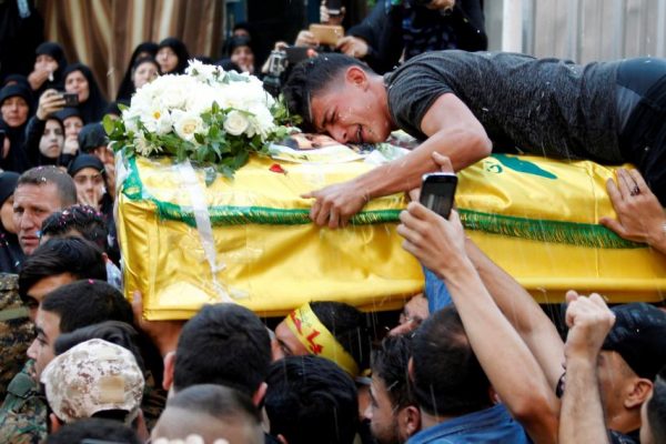 A man clings onto the coffin of Hezbollah fighter Jalal al-Effie, killed during clashes in Aleppo, Syria, during his funeral in Beirut, Lebanon, October 18, 2016. Almost half the total Shia combat fatalities in Syria from September 2012 to April 2017 were reportedly Hezbollah fighters. A total of 1048 Hezbollah fighters were reportedly killed in combat in Syria from September 30, 2012 to April 10, 2017. This number however, must be treated as an absolute minimum, since the Hezbollah leadership has every reason to downplay losses. Giving full information on number of killed would increase domestic (Lebanese) resistance to Hezbollah’s involvement and reveal more information about its forces to its adversaries. AZIZ TAHER/REUTERS