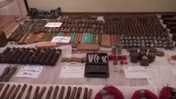 Weapons stored by alleged terror operatives in Kuwait are seized by local security forces, August 2015. (YouTube screenshot)