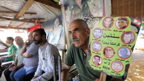 Relatives of Lebanese soldiers taken hostage by jihadists in 2014 sit inside a tent as they gather in downtown Beirut on August 27, 2017 awaiting news of their loved ones. (AFP PHOTO / ANWAR AMRO)
