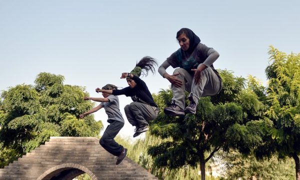 Iranian women practice parkour skills at a park in Tehran. Photograph: Anadolu Agency/Getty Images