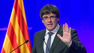 Ousted Catalan leader agrees to election, summoned to Madrid court