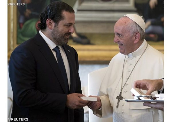 Pope Francis exchanges gifts with Prime Minister of Lebanon Saad Hariri during a private audience at the Vatican, October 13, 2017 - REUTERS