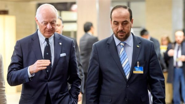 UN Syria envoy De Mistura, left, held talks with Syria's main opposition negotiator Nasr al-Hariri in Geneva on Thursday [Martial Trezzini/Reuters] 
