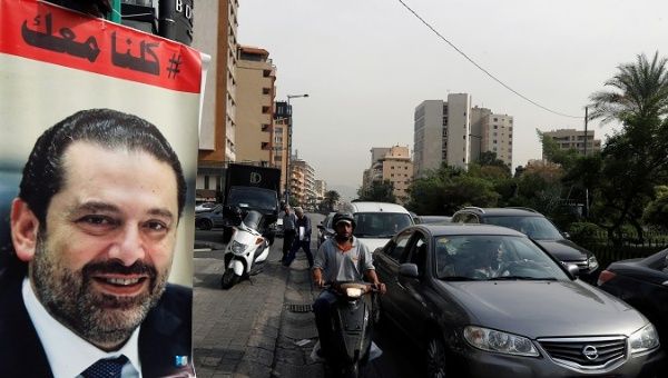 Cars pass next to a poster depicting Saad al-Hariri, who has resigned as Lebanon's prime minister, in Beirut, Lebanon,, Lebanon, November 13, 2017. REUTERS/Mohamed Azakir 
