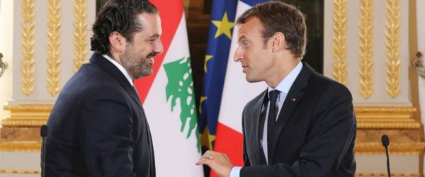 FILE - In this Sept. 1 2017 file photo, French President Emmanuel Macron, right, shakes hands with Lebanese Prime Minister Saad Hariri during a joint press conference at the Elysee Palace in Paris. Hariri has accepted an invitation to come to France after his surprise resignation from Saudi Arabia nearly two weeks ago that stunned Lebanon and rattled the region, the French president's office announced Thursday Nov. 16, 2017. (Ludovic Marin, Pool via AP, File)