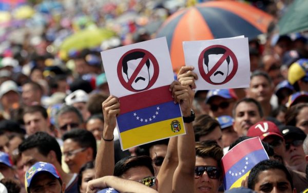 Opposition supporters take part in a rally against President Nicolas Maduro's government in Caracas, Venezuela, 