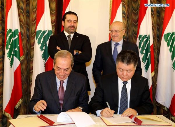 Chinese Ambassador to Lebanon Wang Kejian (R, Front) and Lebanese President of the Council for Development and Reconstruction Nabil El-Jisr (L, Front) sign a project deal in Beirut, Lebanon, on Jan. 9, 2018. The launching ceremony of the Chinese government's funding project to build and equip a new Lebanese National Conservatory of Music was held here on Tuesday. (Xinhua/Dalati & Nohra)