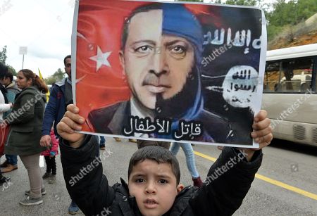 Kurds living in Lebanon    protest against  Turkey's ongoing military operation in northern Syria's Kurdish-controlled Afrin region.  Poster of Erdogan reads : Killer of children