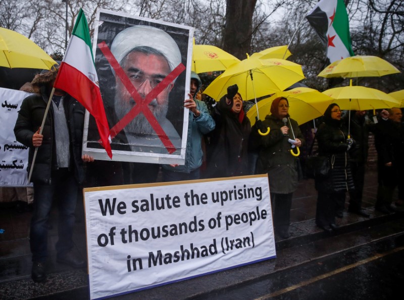 Opponents of Iranian President Hassan Rouhani hold a protest outside the Iranian embassy in west London, Britain December 31, 2017.  REUTERS/Eddie Keogh