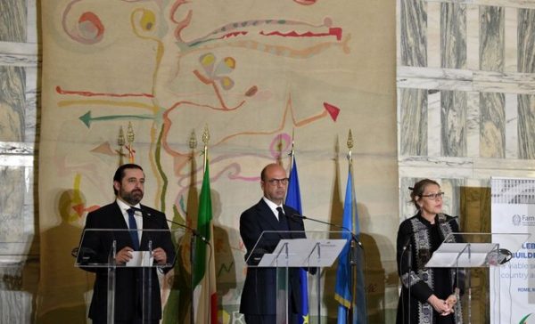 Italian Foreign Minister Angelino Alfano (C) stands along side Lebanese Prime Minister Saad Hariri (L) and UN Special Coordinator for Lebanon Pernille Dahler Kardel, during a joint press conference on the support pledged to the Lebanese security forces, Farnesina palace, in Rome on Mar15, 2018. (AFP)