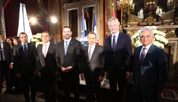 PM Saad Hariri ( C) at the conference . Standing next to him on the left is Carlos Ghosn and on the rightis Gebran bassil