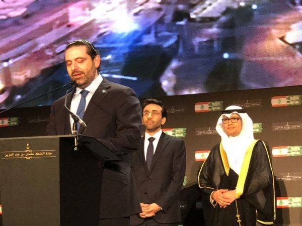 Saudi envoy Nizar Al Alula is shown (R) during Lebanese Prime Minister Saad al-Hariri 's speech honoring King Salman and the Kingdom 