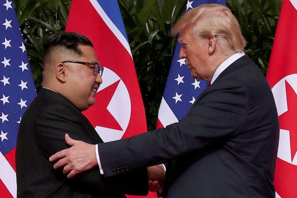 US President Donald Trump shakes hands with North Korean leader Kim Jong Un at the Capella Hotel on Sentosa island in Singapore Tuesday June 12, 2018. Jonathan Ernst, Reuters