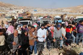 Syrian refugees prepare to return to Syria from the Lebanese border town of Arsal, Lebanon