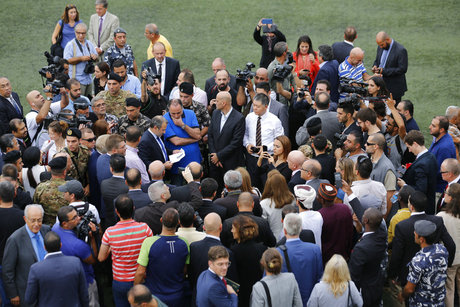 Lebanese Foreign Minister Gebran Bassil, center tours a soccer club, with diplomats and journalists, one of several locations they visited near Beirut's international airport, in Beirut, Lebanon, Monday, Oct. 1, 2018. The ministry-organized tour, including a Golf course and the soccer club, was an effort to dispel Israeli allegations of the presence ofHezbollah missile sites there. (AP Photo/Hassan Ammar)