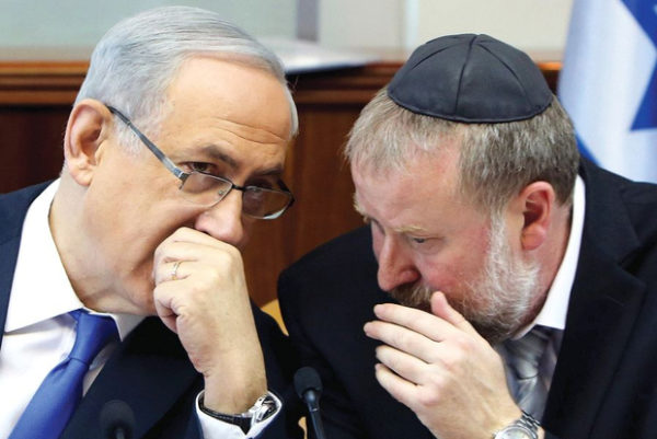 The right-wing tabloid Israel Hayom reported that officials in Netanyahu's Likud party, if not Netanyahu himself (left), were trying to bully Attorney General Mandelblit (right). (Reuters)