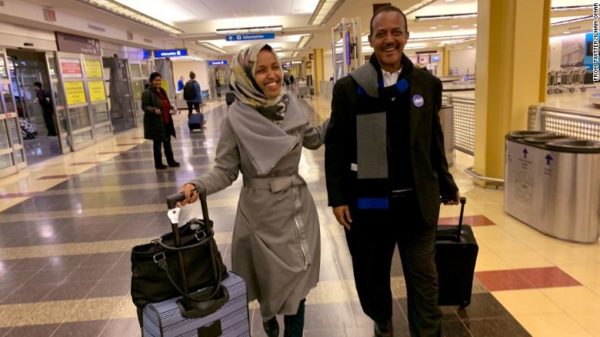 Rep.-elect Ilhan Omar, a Minnesota Democrat who will be the first Somali-American member of Congress, is shown smiling with her father at Washington DC airport