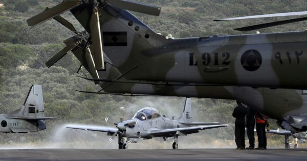 A picture shows an A-29 Super Tucano aircraft being sprayed with water as a welcome ritual during a handover ceremony by the U.S. Lebanon received the second lot of four A-29 Super Tucano in June 2018 in its bid to assist the Lebanese armed forces. (Joseph Eid/AFP/Getty Images)