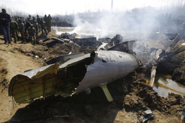 Indian army soldiers stand near the wreckage of the aircraft after it crashed in central Kashmir's Budgam district. Pakistan has said it has shot down two Indian aircraft. Photo by Farooq Khan/EPA-EFE