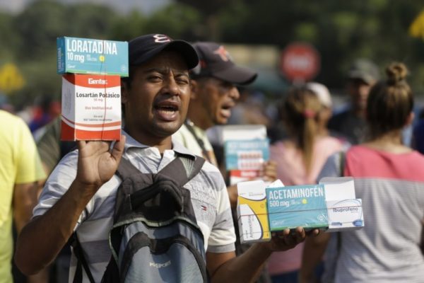 A Venezuelan sells medicines at s street in La Parada, on the outskirts of Cucuta, Colombia, on the border with Venezuela, Wednesday, Feb. 6, 2019. Tensions in the area have risen since the Venezuelan military blocked a border bridge where humanitarian aid is expected to arrive with a tanker and two cargo trailers, Colombian officials said Monday, in an apparent bid to stop the loads of food and other supplies from entering the country. (AP Photo/Fernando Vergara)