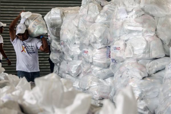A volunteer sorts U.S. humanitarian aid packages in Cucuta.Photographer: Ivan Valencia/Bloomberg