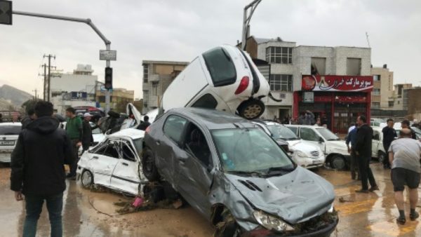 Cars pilled up in a street of the southern Iranian city of Shiraz where at least 11 people were killed and 68 injured in flooding Cars pilled up in a street of the southern Iranian city of Shiraz where at least 11 people were killed and 68 injured in flooding MEHR NEWS/AFP
