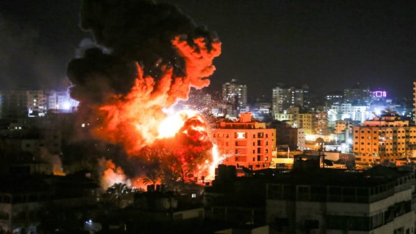 Flames and smoke are seen during an Israeli air strike in Gaza City [