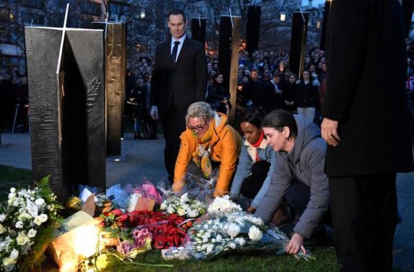 People take part in a vigil at the New Zealand War Memorial on Hyde Park Corner in London, Friday, March 15, 2019. Other members of Britain’s royal family have followed Queen Elizabeth II in expressing their sadness over the shootings in Christchurch New Zealand. In a joint statement, Princes William and Harry, together with their spouses, the Duchess of Cambridge and the Duchess of Sussex, said that their hearts go out to those who lost their lives in the mosque shootings. (Dominic Lipinski/PA via AP) THE ASSOCIATE PRESS