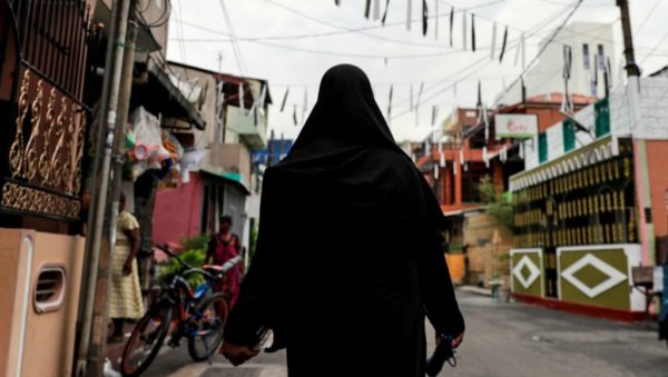 Danish Siddiqui, REUTERS | A woman wearing a face-covering veil walks through a street near St Anthony's Shrine in Colombo, days after Sri Lanka's deadly suicide attacks.