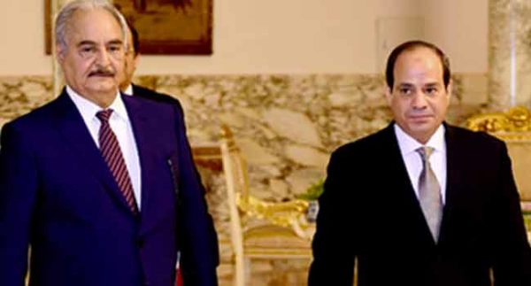 Libyan military commander Khalifa Haftar walks with Egyptian President Abdel Fattah al-Sisi at the Presidential Palace in Cairo, Egypt April 14, 2019 in this handout picture courtesy of the Egyptian Presidency. The Egyptian Presidency/Handout via REUTERS