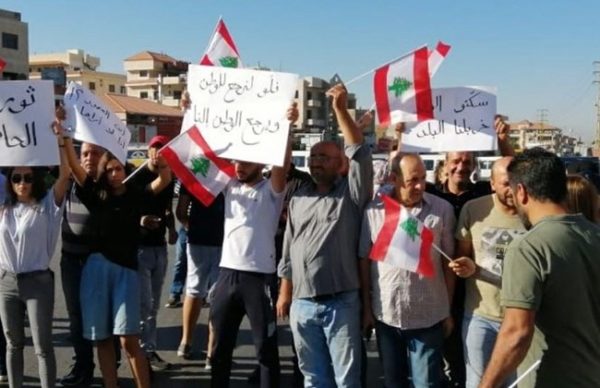 Demonstrators block a road in Baalbeck, Sept. 29, 2019 in protest against the worsening economic situation 