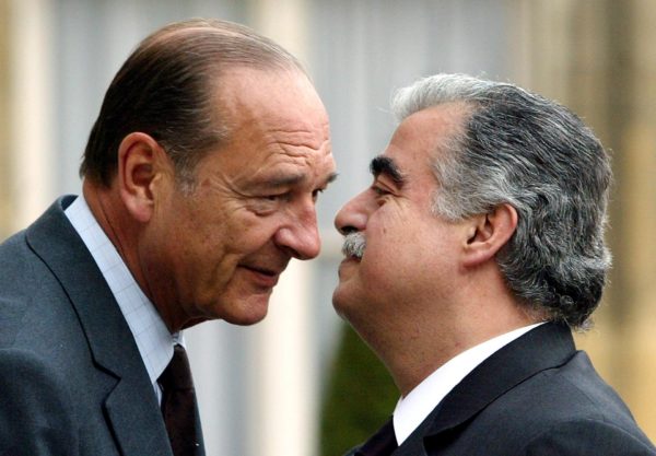 File photo: French President Jacques Chirac (L) welcomes Lebanese Prime Minister Rafiq Hariri in Paris on April 25, 2003