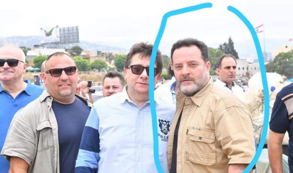 Albert Silver shown inside the blue circle is the FPM  supporter  who led the attacks  against the protesters 