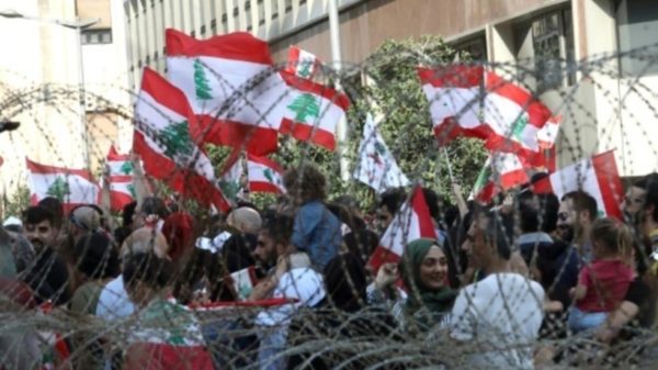 LEBANESE protest near the seat of the government -- many for the first time, and several to demand a better future for their children.