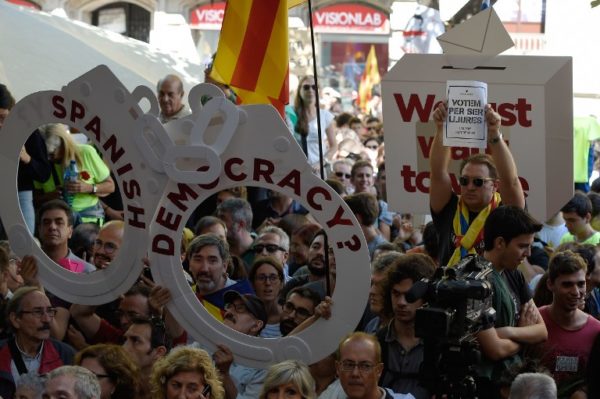 Angry protests break out in Barcelona as police detain Catalan officials