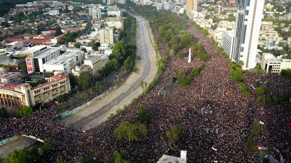 In this aerial view, thousands of people protest in Santiago [Pedro Ugarte/AFP]  