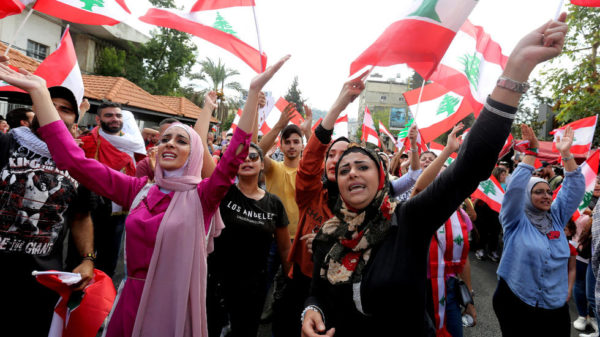  Demonstrators gesture and chant slogans during an anti-government protest in the southern city of Nabatiyah, Lebanon, October 20, 2019.