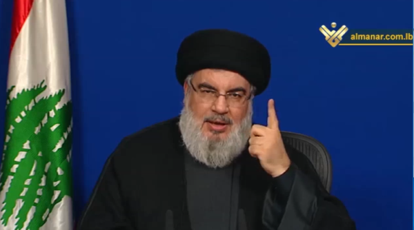 For the first time Hezbollah chief Hassan Nasrallah displays the Lebanese flag instead of the Hezbollah flag during his televised speech 