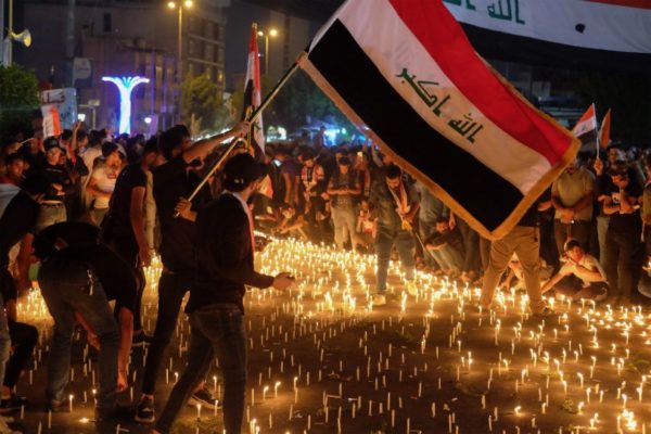 Iraqi protesters hold a candlelight vigil for victims killed during anti-government demonstrations in the Shiite shrine city of Karbala, south of Iraq's capital Baghdad, on November 1, 2019. - Iraq's top cleric warned foreign actors against interfering in his country's anti-government protests as they entered their second month despite pledges of reform and violence that has left over 250 dead. The demonstrations have evolved since October 1 from rage over corruption and unemployment to demands for a total government overhaul -- shunning both politicians and religious figures along the way. (Photo by Mohammed SAWAF / AFP) (Photo by MOHAMMED SAWAF/AFP via Getty Images)