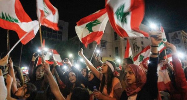 Lebanese demonstrators hit the streets again on Tuesday evening to demand a new government, facing off in some areas with security forces attempting to re-open blockaded roads.